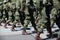 Military marching in a street. Legs and shoes in line