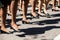 Military marching in a street. Legs and shoes in line