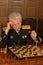 Military mature general playing chess
