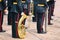 Military musicians on parade with wind instruments in their hands - trombone, tuba, trumpet, saxophone