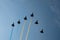 Military parade of 30 years Independence Day of Ukraine. Black silhouettes of six aircrafts flying with color smoke