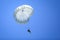 Military paratroopers jump from an Alenia C-27J Spartan military cargo plane