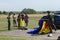 Military paratroopers prepare the parachute for launch at the air show at the Stanesti aerodrome, Gorj, Romania