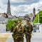 Military patrol on the street of Brussels, summer day