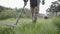 Military sapper with a metal detector in the field