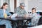 Military serviceman sitting near girl drawing