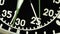 Military stopwatch clock face close up.