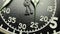 Military stopwatch clock face close up.