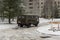 A military-style medical car drives up to hospital on broken winter road