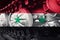 Military tank close-up Caterpillar Track with Syrian flag Background.