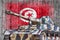 Military tank with concrete Tunisia flag