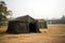 Military tent in the field. big tent city. field camp in nature. military base with temporary barracks. military exercises of the