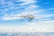 Military uav drone flight flies above the clouds