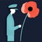 military veteran wearing military fatigues next to a red poppy flower