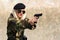 Military woman with handgun