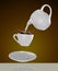 Milk being poured into small cup of coffee. 3d