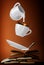 Milk being poured into small cup of coffee. 3d
