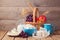 Milk, cheese and fruit basket over wooden background. Jewish holiday Shavuot celebration