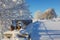 Milk churn stand in a beautiful snowy winter landscape