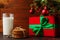 Milk, cookies and gifts under the Christmas tree. The concept of the arrival of Santa Claus