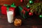 Milk, cookies and gifts under the Christmas tree. The concept of the arrival of Santa Claus