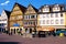 The milk fountain on the market square of Bad Mergentheim, in front of half-timbered houses.