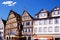 The milk fountain on the market square of Bad Mergentheim, in front of half-timbered houses.