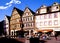 The milk fountain on the market square of Bad Mergentheim, in front of half-timbered houses.