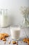 Milk with freshly baked homemade cookies with peanuts on a light background