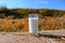 Milk in a glass on the background of a natural field in Israel. Milk, milk drink or dairy product in Israel