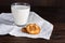 Milk in glass and homemade cookies wooden tabletop