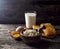 Milk in glass, honeycomb and eggs on a wooden background. Cottage cheese in a wooden bowl, rustic style. Dairy products in the mo