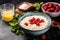 milk porridge with fresh raspberries on a dark background