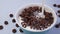 Milk pouring into bowl of chocolate corn rings