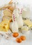 Milk products, bread and eggs on a wooden table.