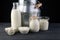 milk products - tasty healthy dairy products on a table on: sour cream in a white bowl, cottage cheese bowl, cream in a a bank and