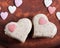 Milk sesame sweets in the form of heart, on a brown plate