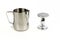 Milk steamer and coffee tamper standing on end on an isolated surface