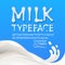 Milk uppercase and lowercase alphabets with symbols and numbers isolated on blue background with milk splash