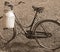 Milking bike with bin for milk transport sepia effect