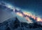 Milky Way above snowy mountains at night. Space