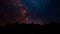 The milky way appears from behind the trees. Perseid meteor shower bristlecone milky way timelapse. Night sky animation