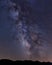 Milky way arch over Torre de Barrio village in Leon