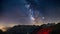 The Milky Way arch starry sky on the Alps, Massif des Ecrins, Briancon Serre Chevalier ski resort, France. Panoramic view high
