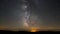 Milky Way Galaxy astronomy time lapse stars moving above mountain valley light pollution near horizon bright night campside summer