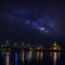 Milky way galaxy over bridge and temple