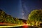 Milky Way galaxy on the side of the highway near Ulm with car trails, Germany