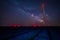 The milky way galaxy stars seen in a lavander field with eolian turbines