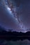 Milky Way landscape. Clearly Milky way above Lake Segara Anak inside crater of Rinjani mountain on night sky. Indon