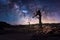 Milky way with lonely tree in dark night